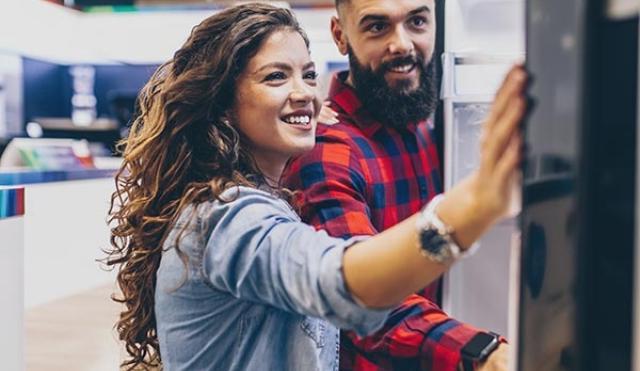 Couple looking at fridge